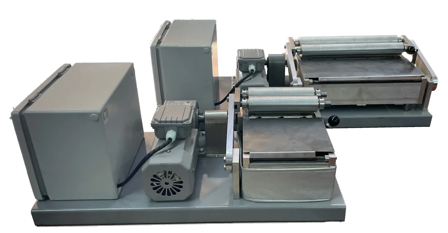 DATCO Filter Roll assembly showing the stainless application roll, double hold-down roll, and gear-motor drive
